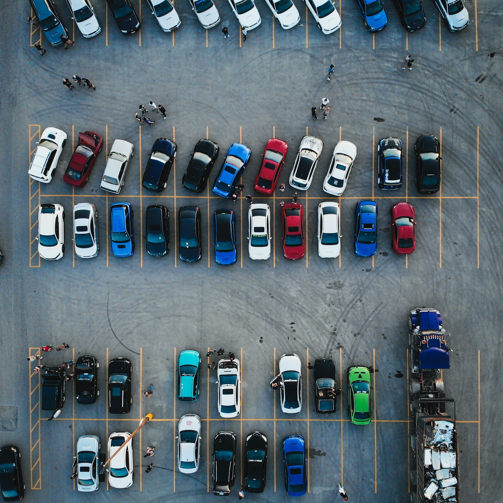 Rows of used cars parked on a dealership lot in daylight